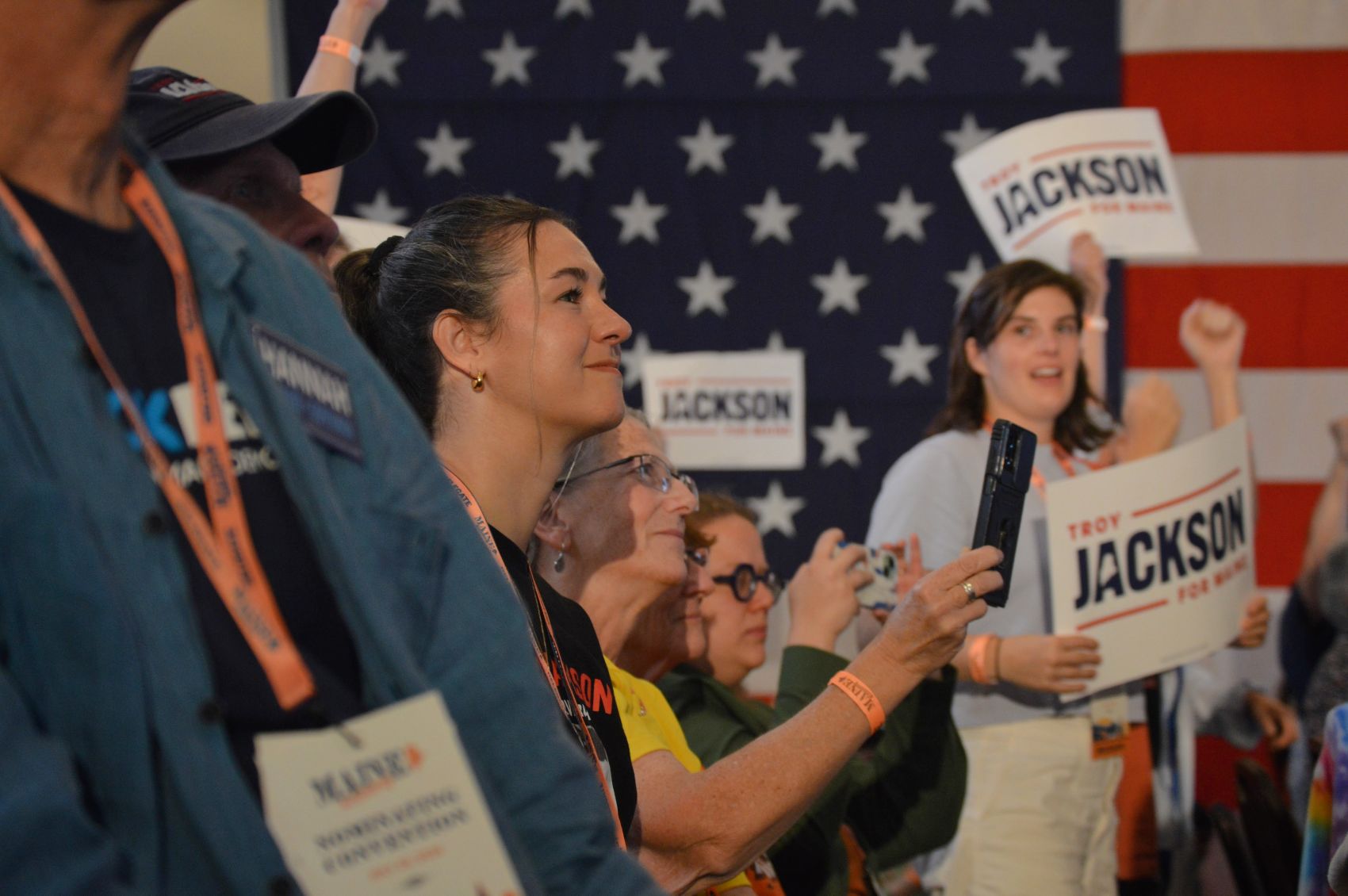 delegates stand in the crowd