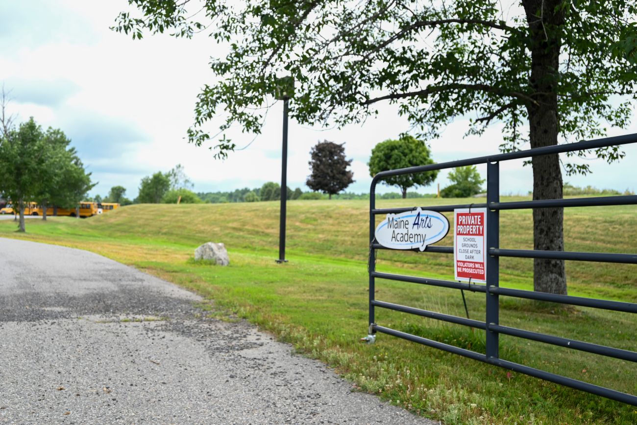 the open gate entrance to the school