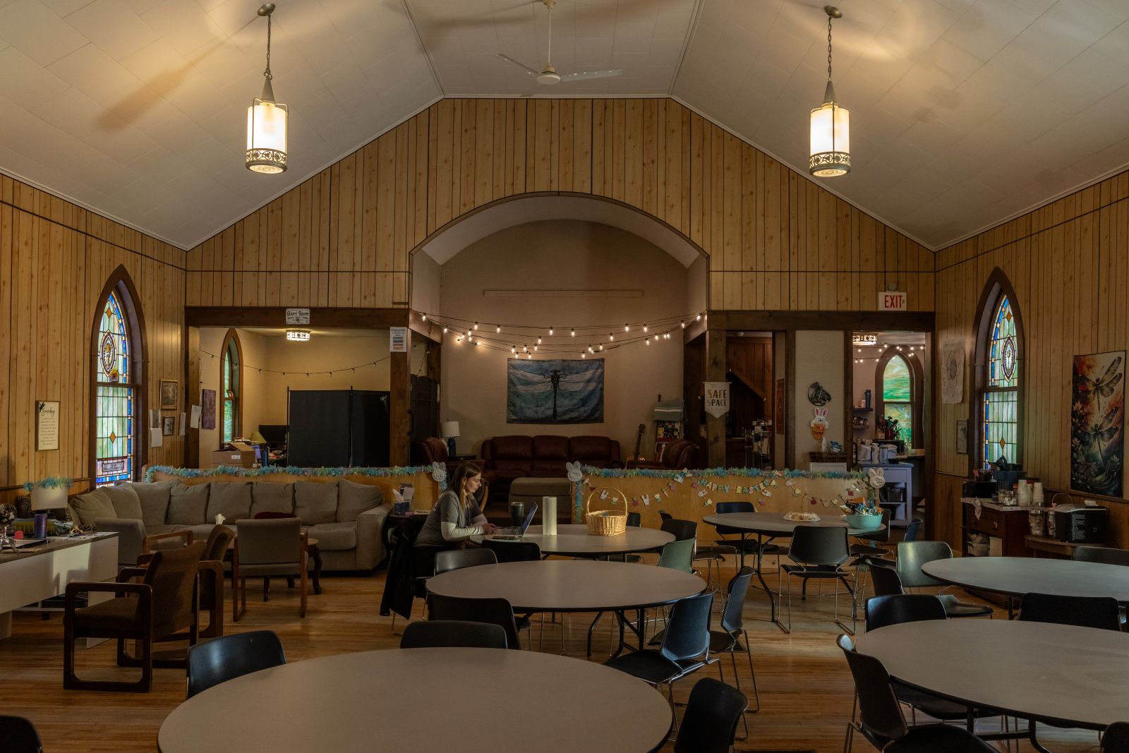 a worker sits inside the Recovery Wellness Community Center
