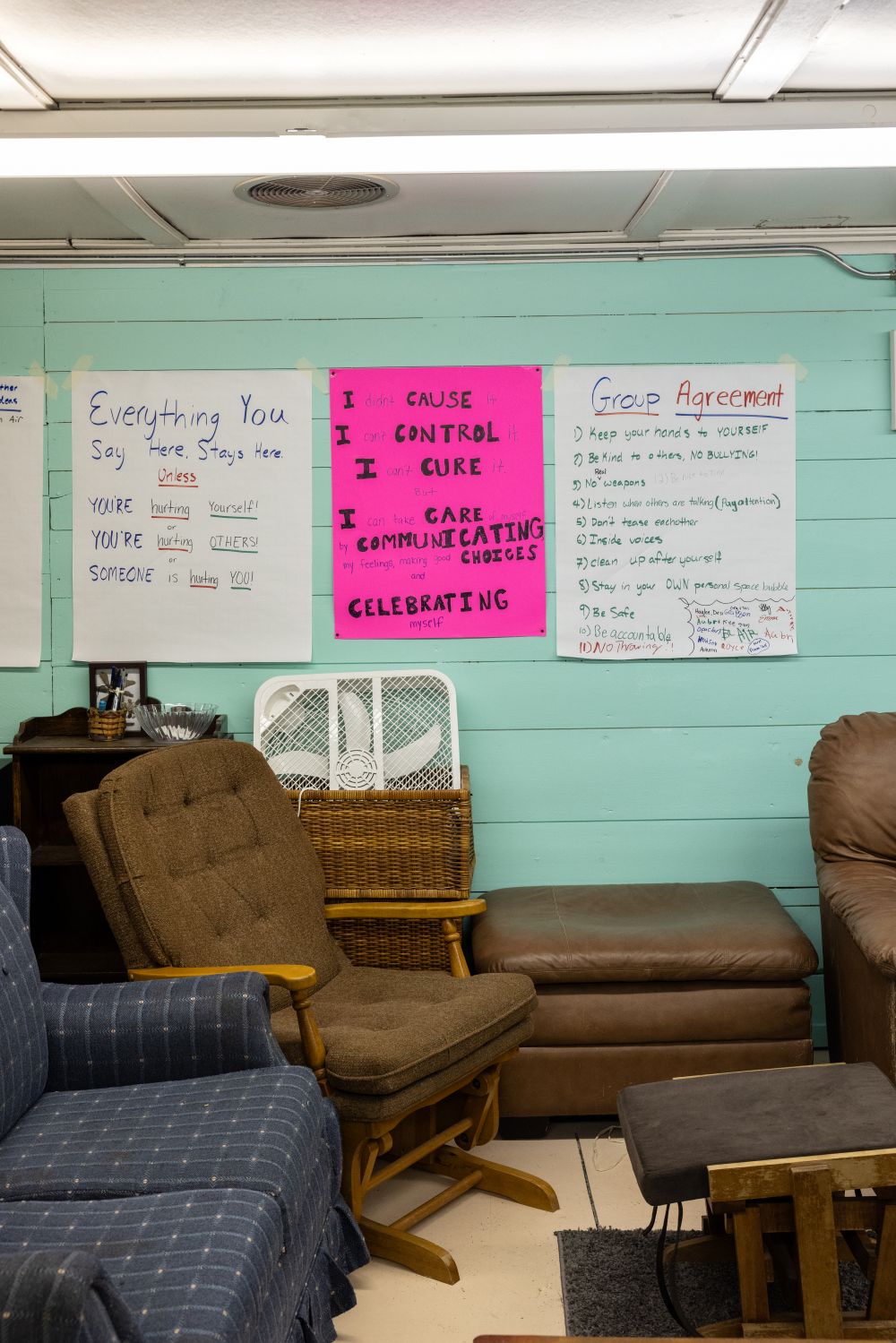 posters with encouraging messages hang on a wall