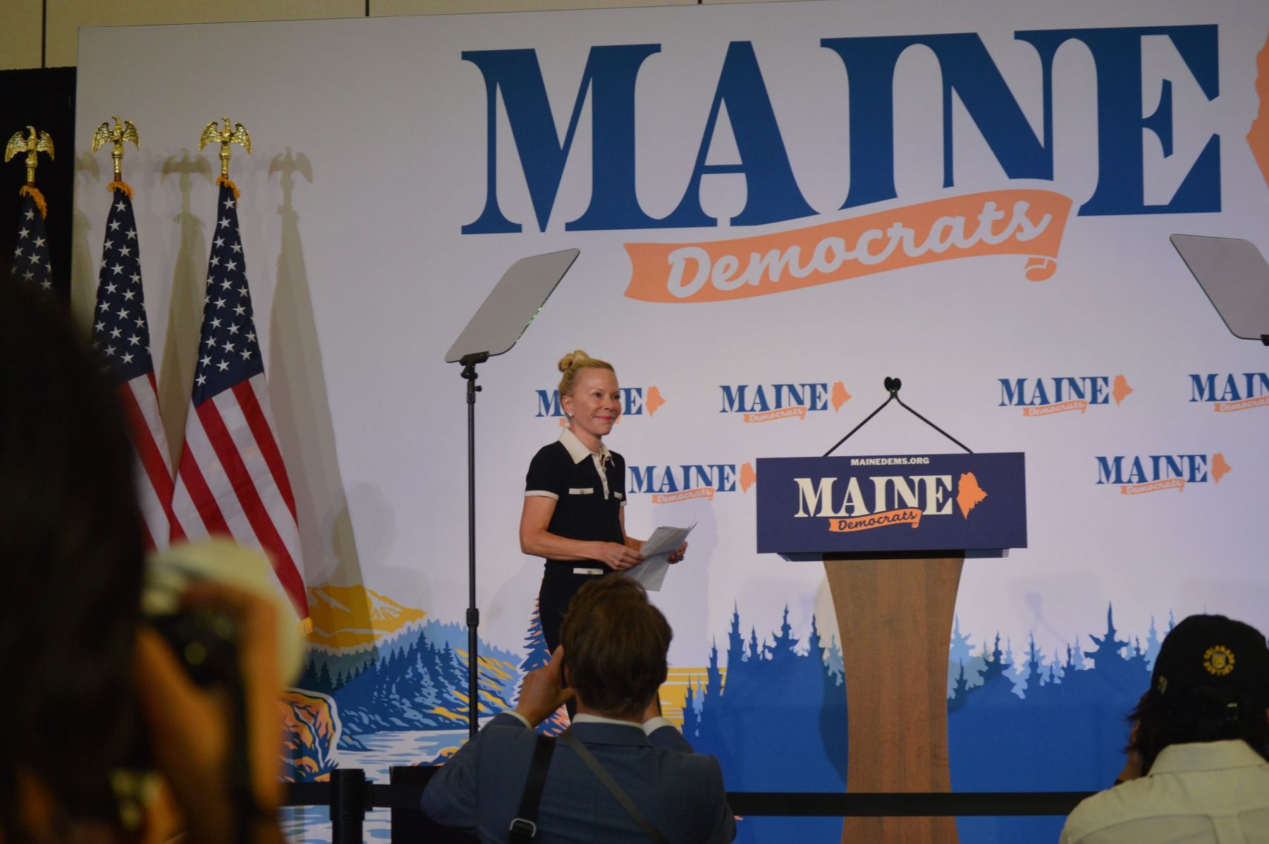 Saundra Pelletier walking to a podium