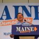 Troy Jackson smiles while standing at the podium during the convention.