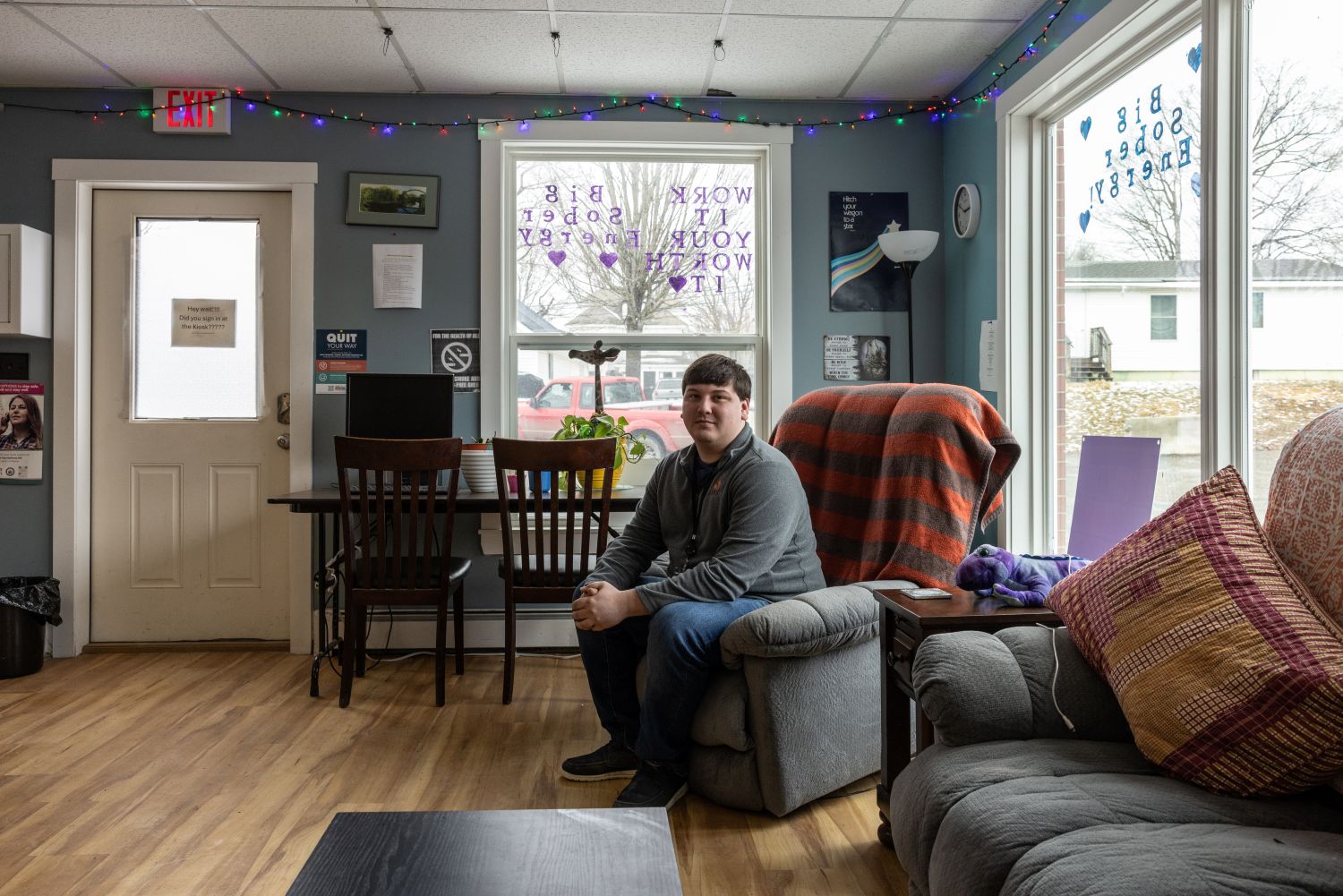 zach jeffrey poses for a photo while sitting in a recliner.