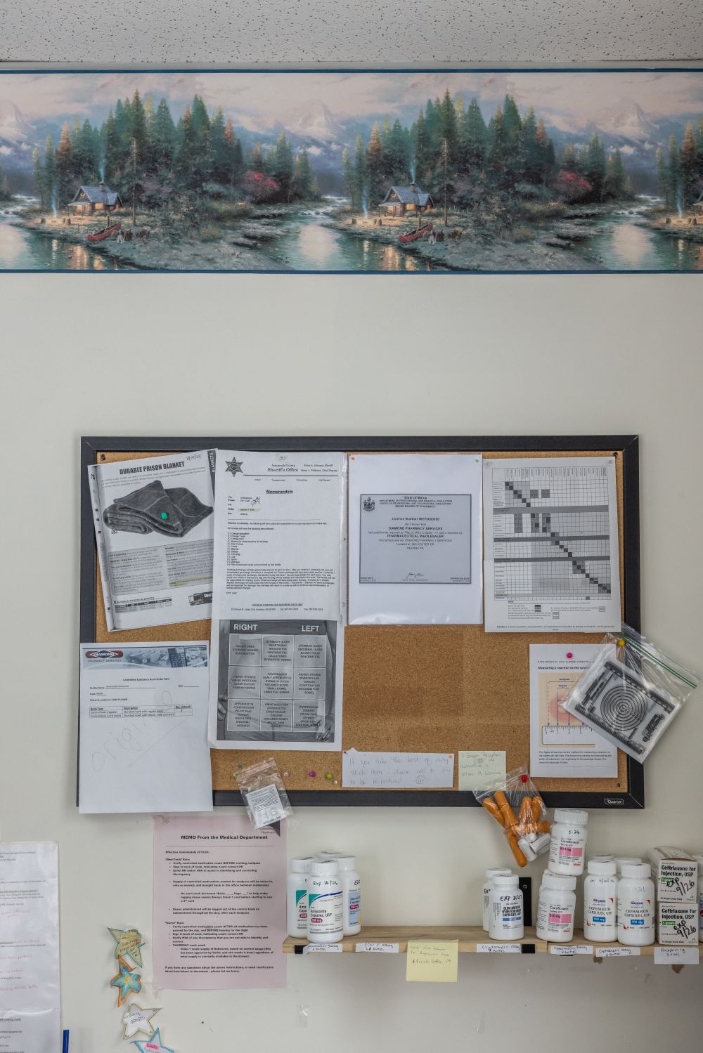 papers are attached to a bulletin board