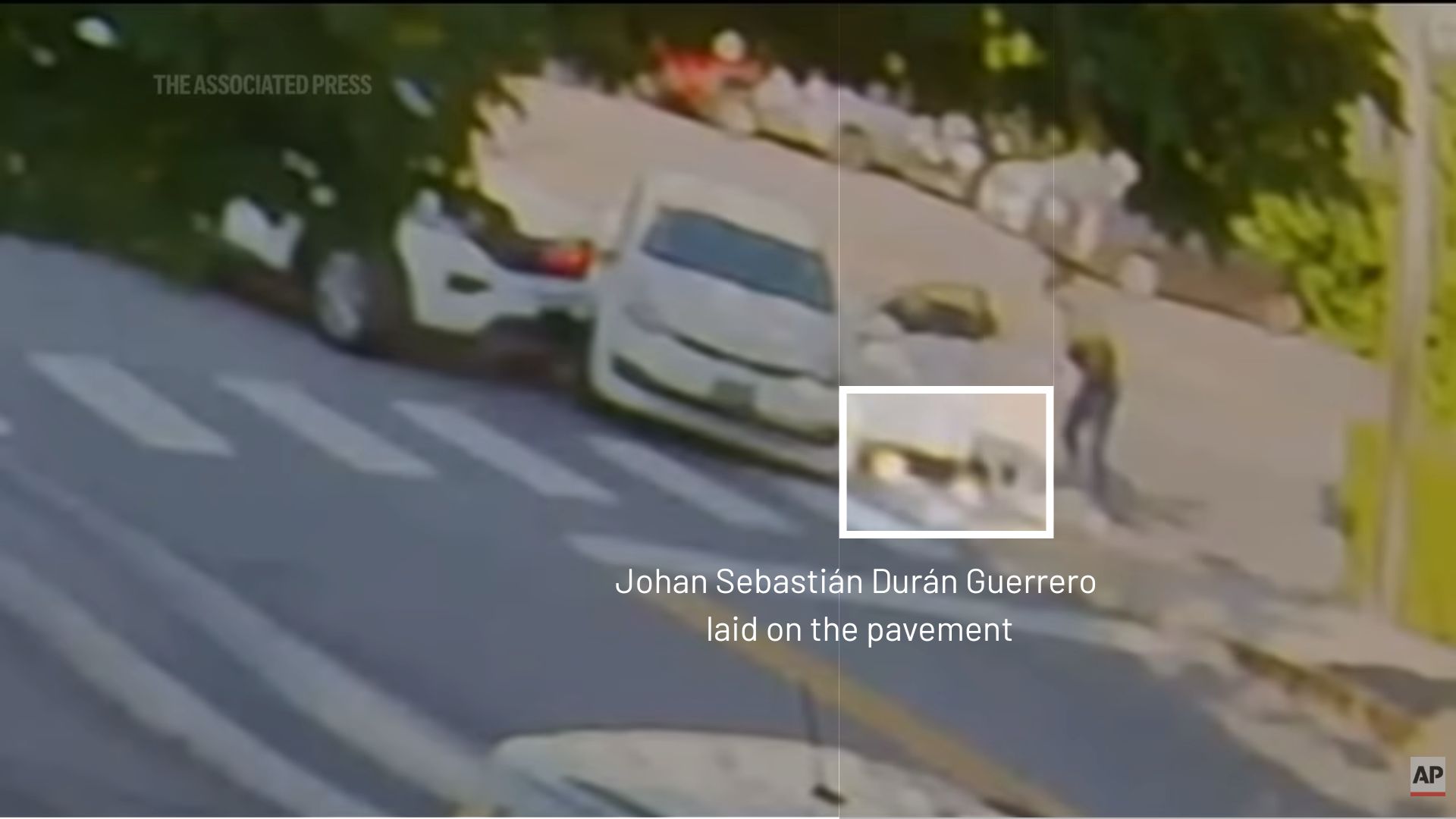 a still from a video that shows the individual lying on the ground.