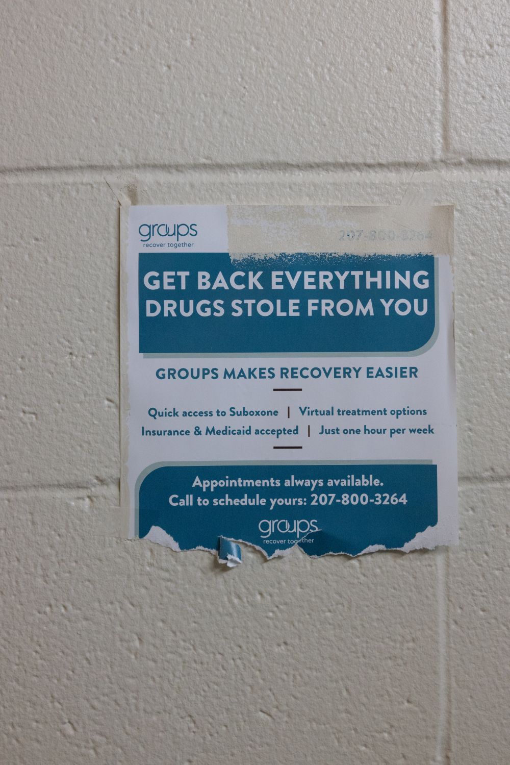 a flyer about recovery hangs on a wall