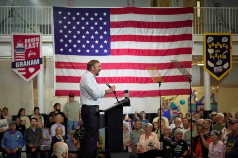 Graham Platner speaks during an election night victory speech.