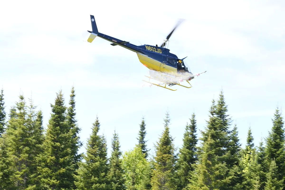 helicopter spraying pesticides