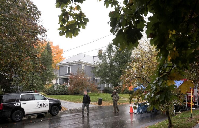 police gathered on a street.