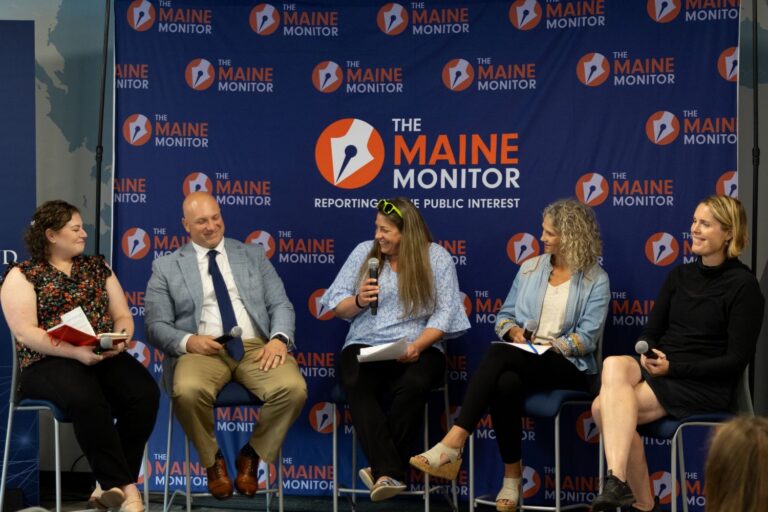 panelists seen on stage during the event