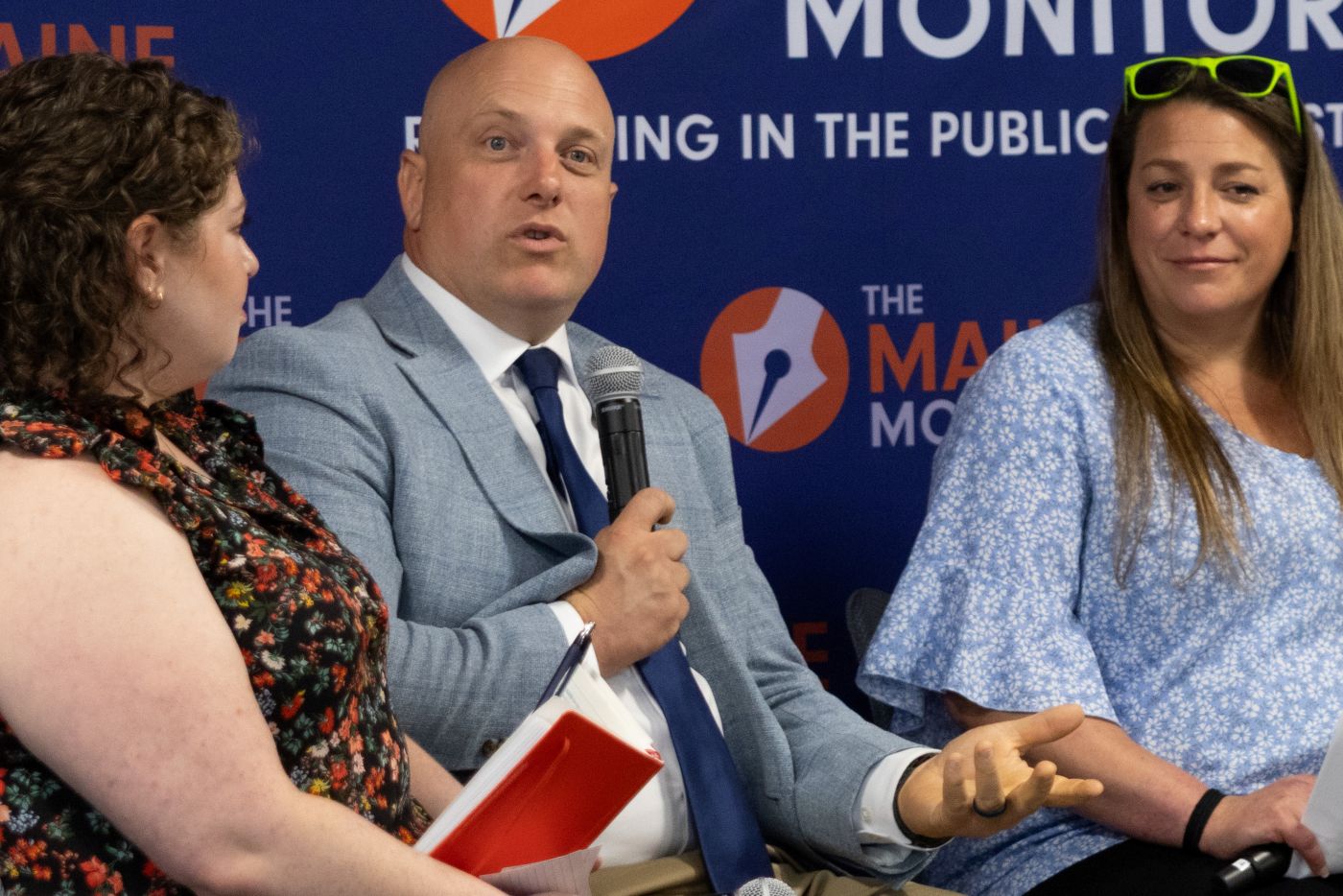 three of the panelists seen during the discussion.