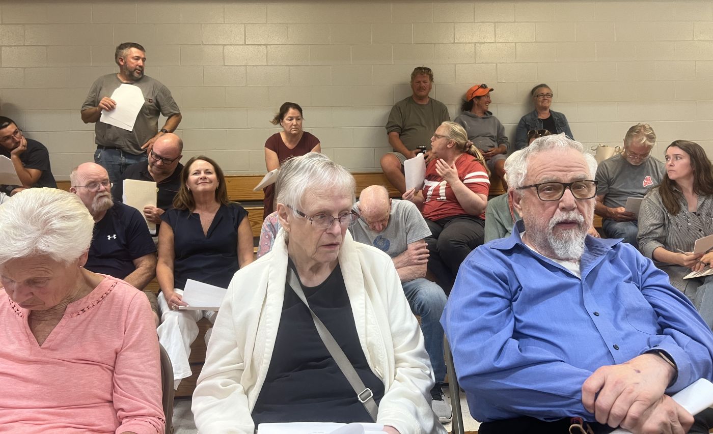 frank smith answers a question while standing in the crowd