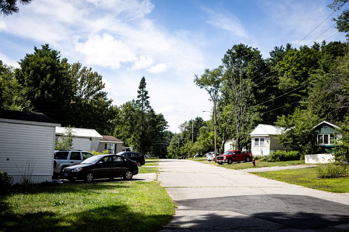 mobile homes line both sides of a road.