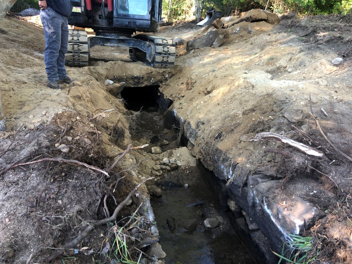 an excavator preps the standish brook area