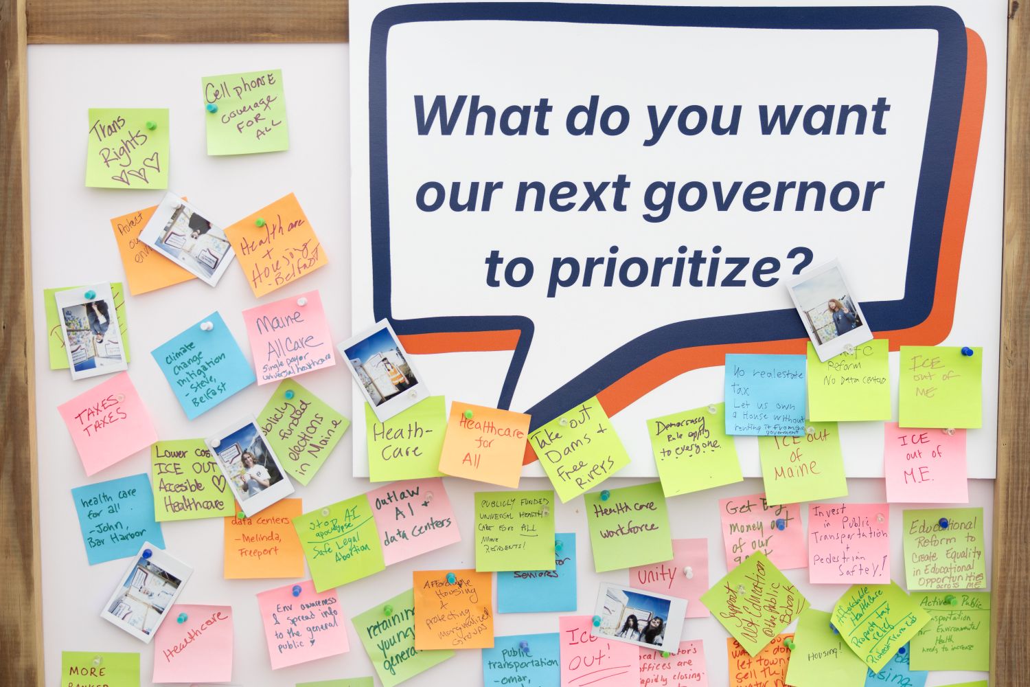 sticky notes cover a board. on each sticky note is what mainers want the next governor to prioritize.