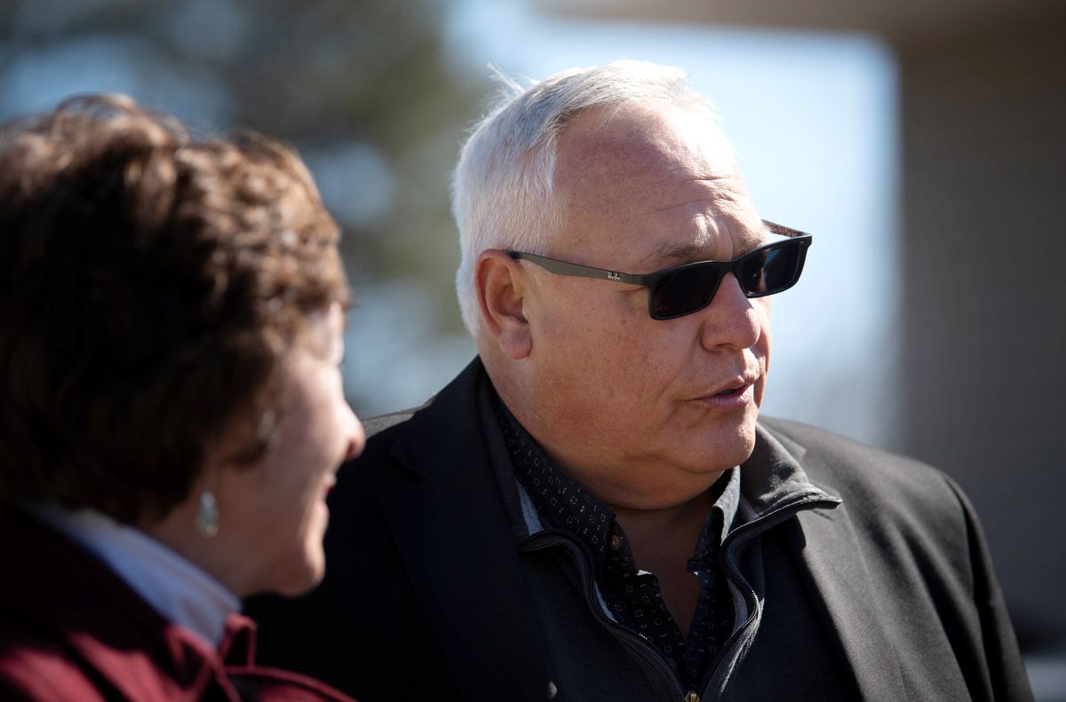 Christopher Littlefield stands next to Susan Collins