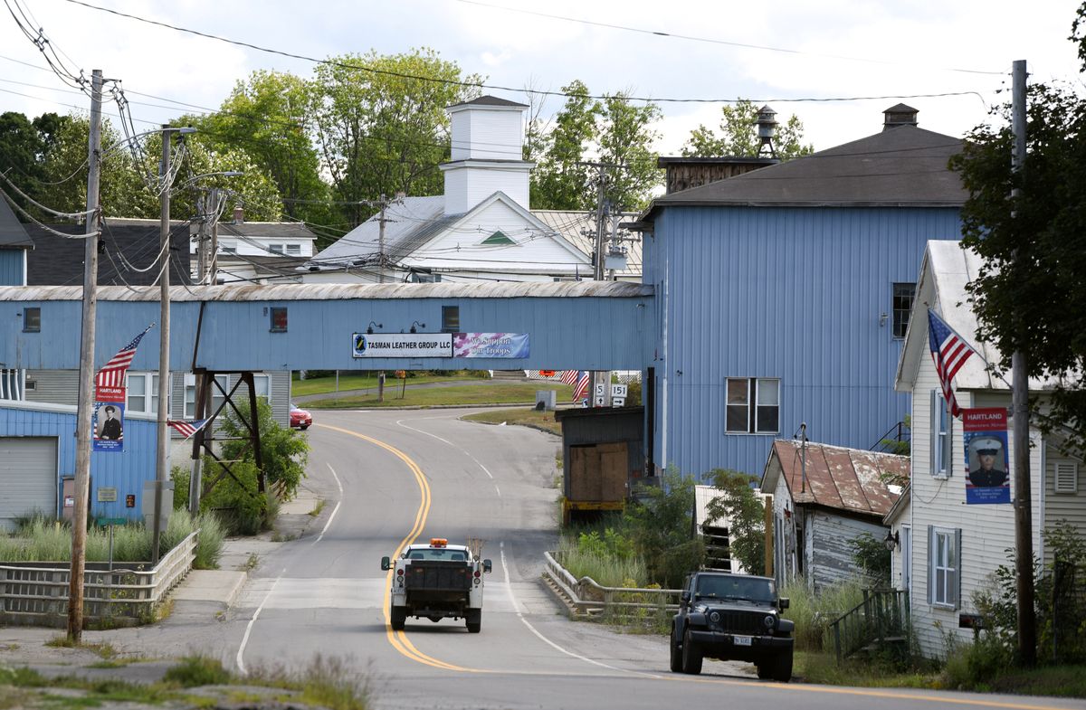 cars drive through Main Street in Hartland.