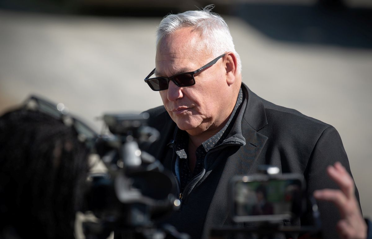 christopher littlefield speaking with reporters
