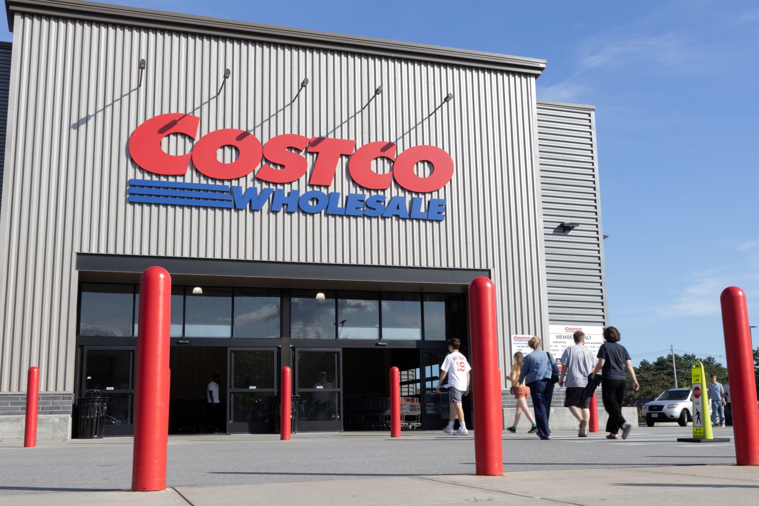 shoppers walking up to a costco entrance