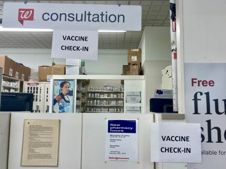 signs for flu vaccine check-in counter