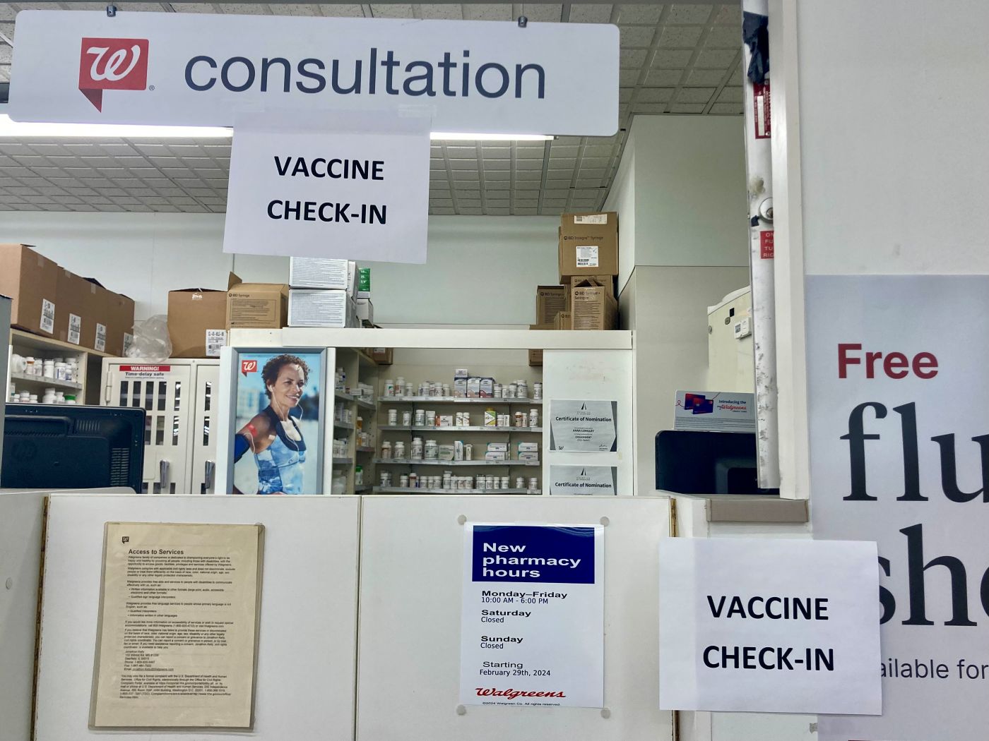 signs for flu vaccine check-in counter