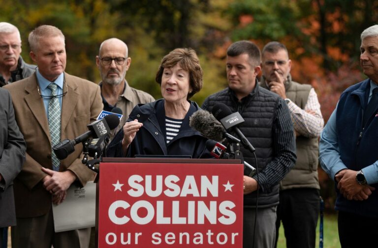 Susan Collins speaks at a podium during a campaign endorsement event.