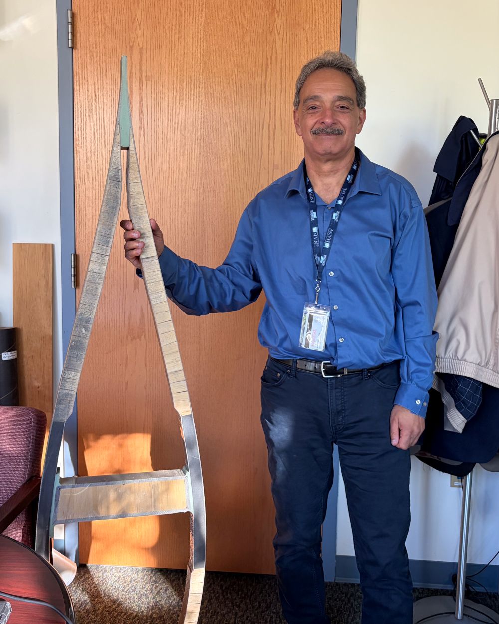 Habib Dagher poses with a miniature turbine blade frame