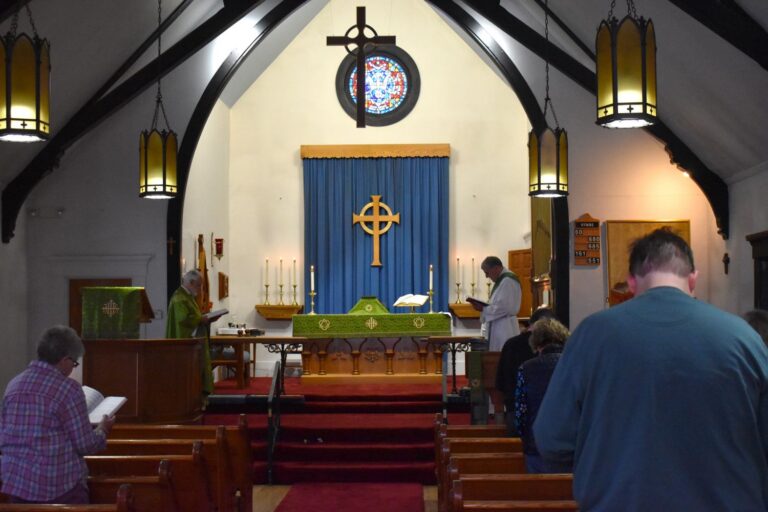 the congregation stands during a church service