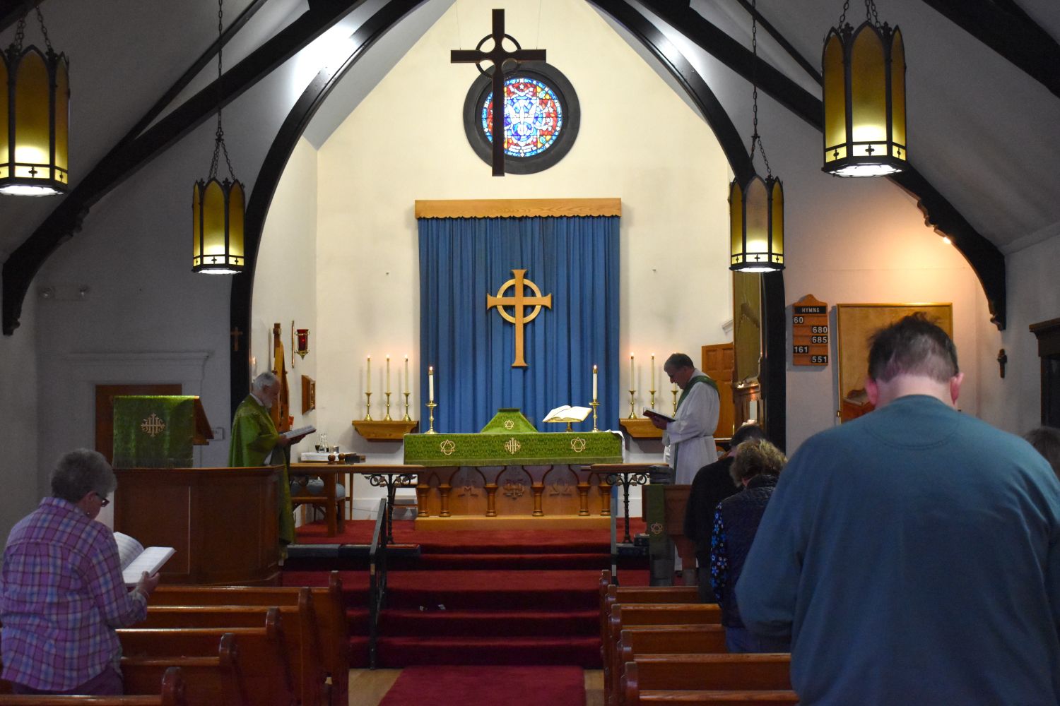 the congregation stands during a church service