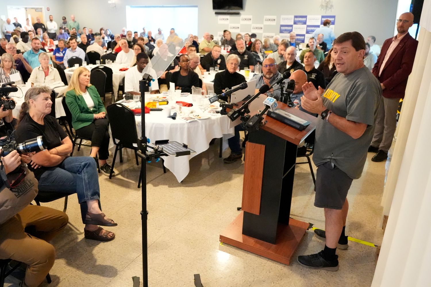 Troy Jackson speaks while standing at a podium.